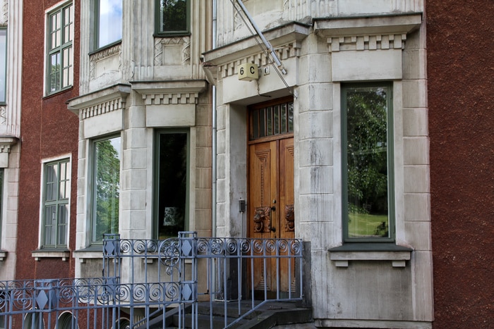 Exterior view of a wooden Business Security Door that is closed