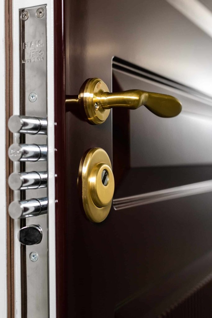 Security Door with brass handles and multipoint locks.