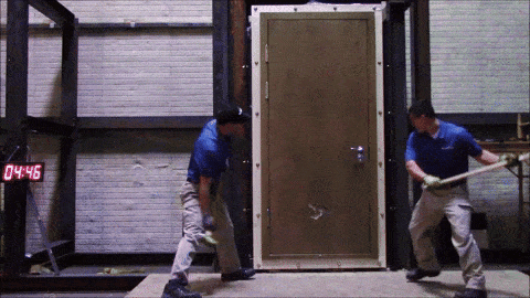 Men testing the strength of a high-security door using US State Department SD.STD-01.01