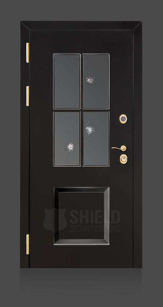 A black security door with four glass panels, two of which have bullet holes. The door features gold hinges, a handle, and two locks, with the words Shield Security Doors faintly visible at the bottom.