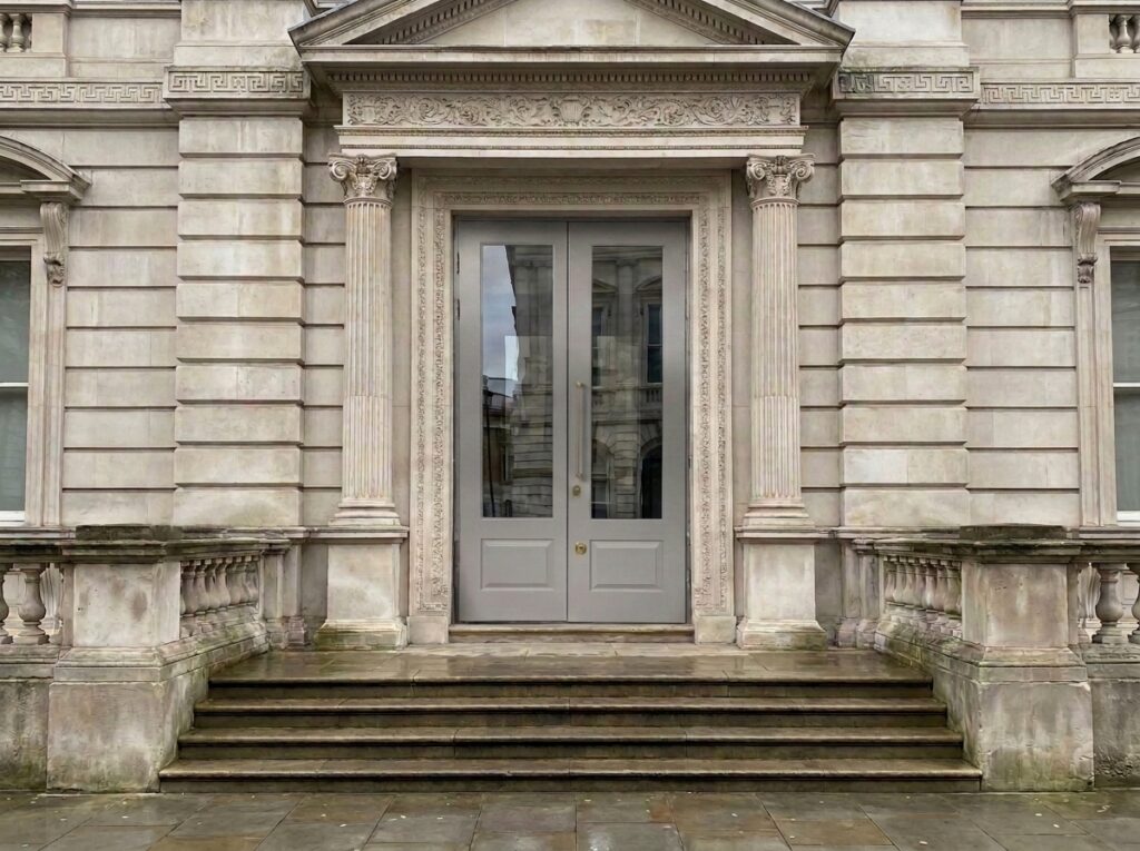 A high security door at the entrance of an embassy building